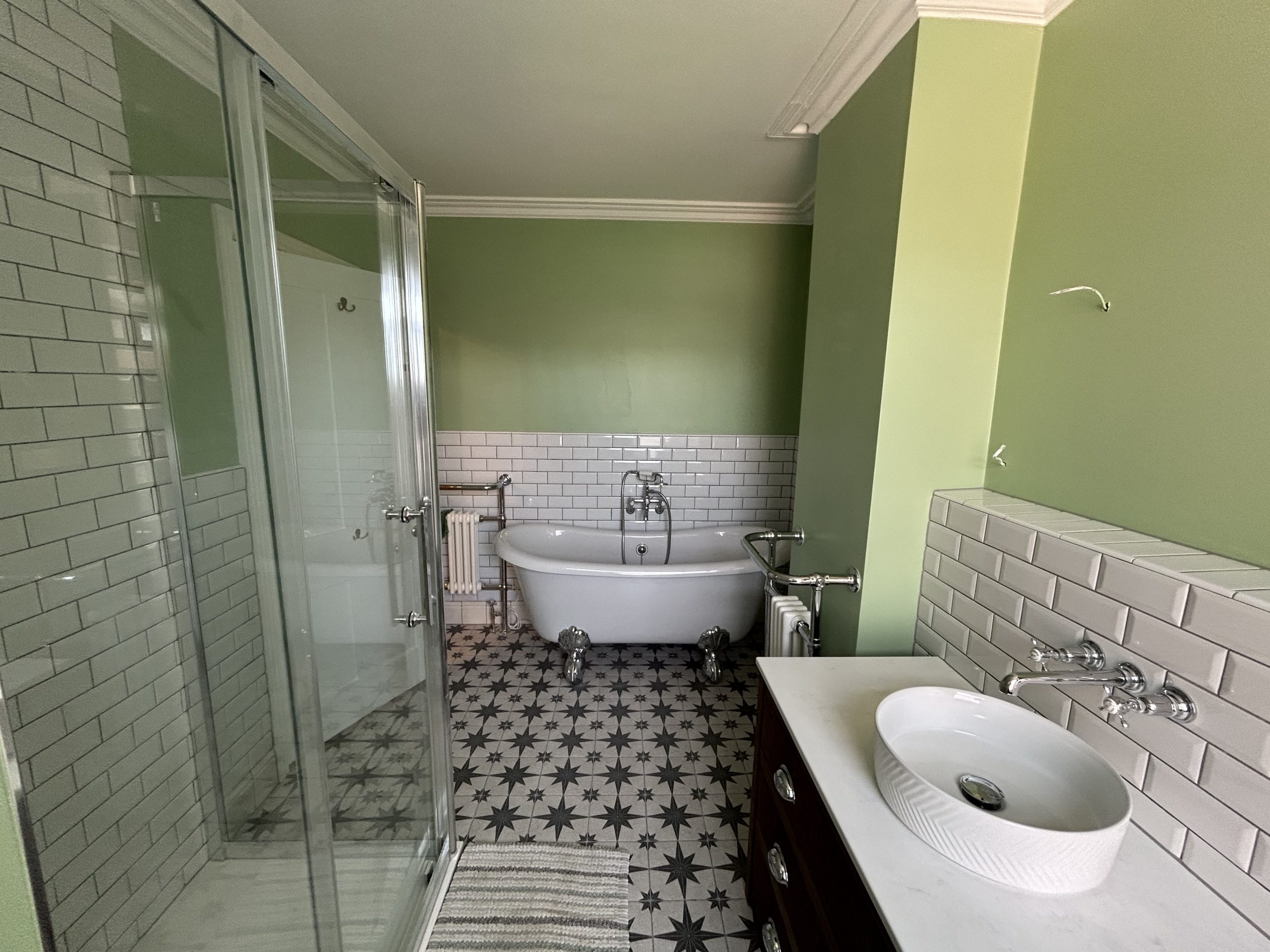 Luxury bathroom renovation with freestanding bath, walk-in shower and Victorian-style fittings completed by Da Vinci Builders in Reading, Berkshire.